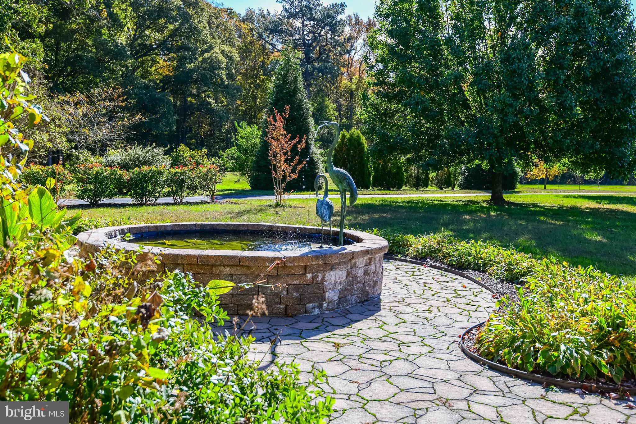 34645 Winding Road Frankford, DE 19945 - Photo 71 of 111 Brick walkway with water fountain