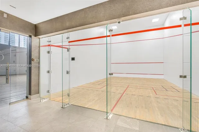 a bathroom with a shower and a glass door