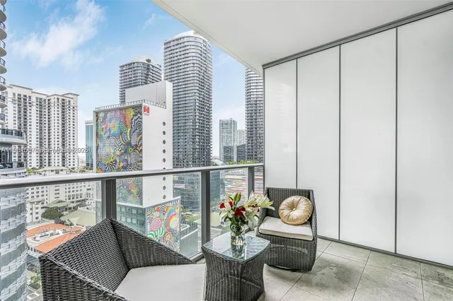 a living room with furniture and flowers