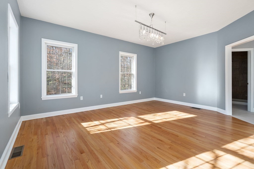 41 Mockingbird Hill Road Windham, NH 03087 - Photo 13 of 36 a view of empty room with wooden floor and fan