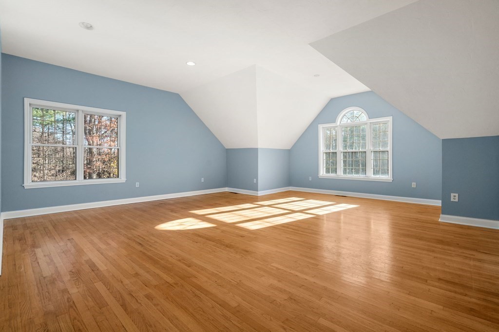 41 Mockingbird Hill Road Windham, NH 03087 - Photo 19 of 36 an empty room with wooden floor and windows