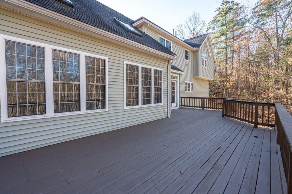 41 Mockingbird Hill Road Windham, NH 03087 - Photo 29 of 36 a view of a house with a deck