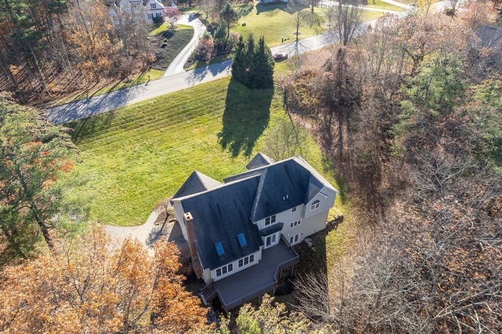 41 Mockingbird Hill Road Windham, NH 03087 - Photo 31 of 36 a wooden bench sitting in the middle of a yard