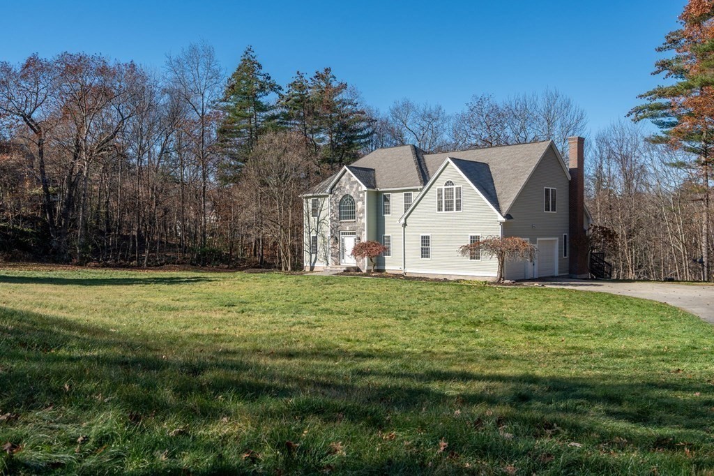 41 Mockingbird Hill Road Windham, NH 03087 - Photo 35 of 36 a view of a yard in front of a house with large trees