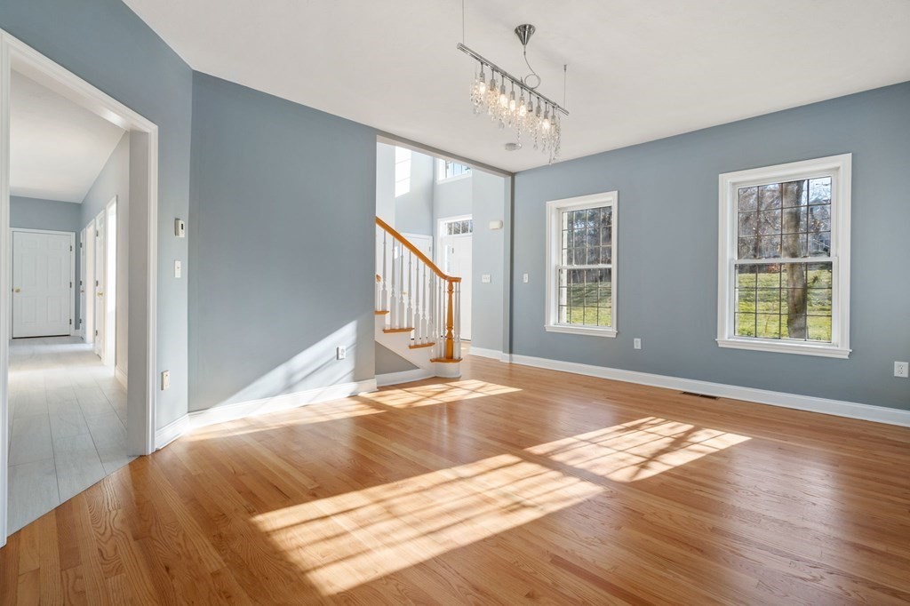 41 Mockingbird Hill Road Windham, NH 03087 - Photo 5 of 36 a view of a livingroom with wooden floor and a window