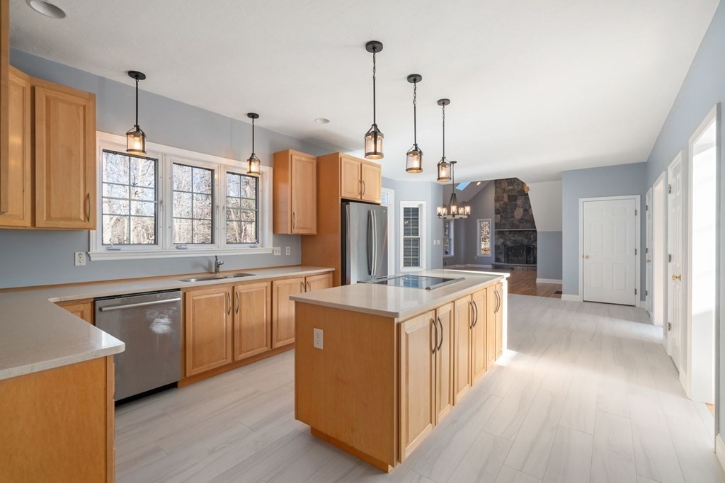 41 Mockingbird Hill Road Windham, NH 03087 - Photo 10 of 36 a kitchen with stainless steel appliances granite countertop a stove and a sink