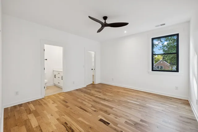 a bathroom with a toilet sink and vanity