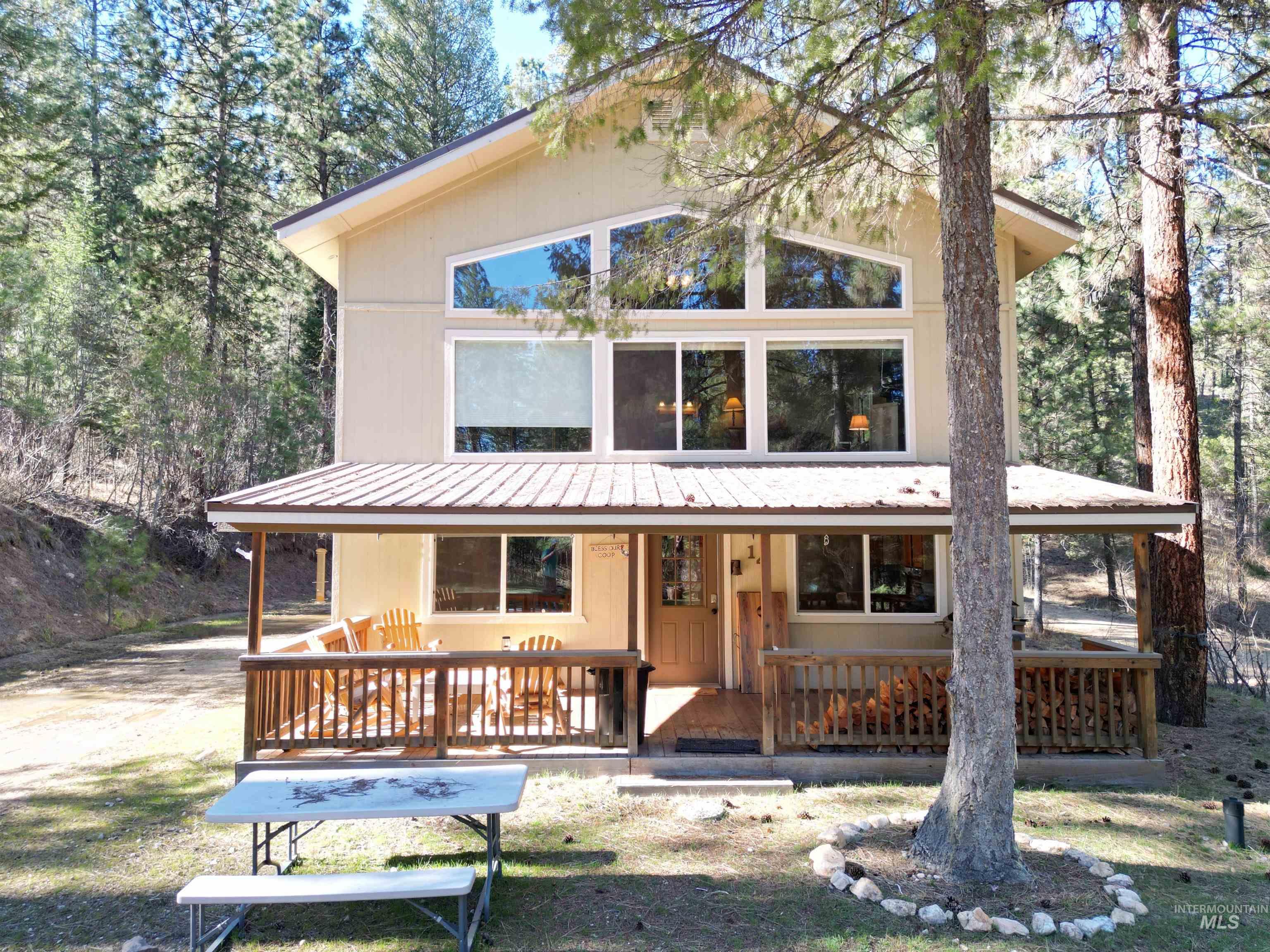 14 Forest Trail Road Garden Valley, ID 83622 - Photo 1 of 45 Two-story residence featuring a covered front porch with wood railings and posts