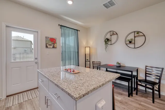 a kitchen with a table and chairs in it