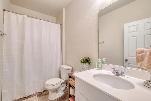 a bathroom with a sink and toilet