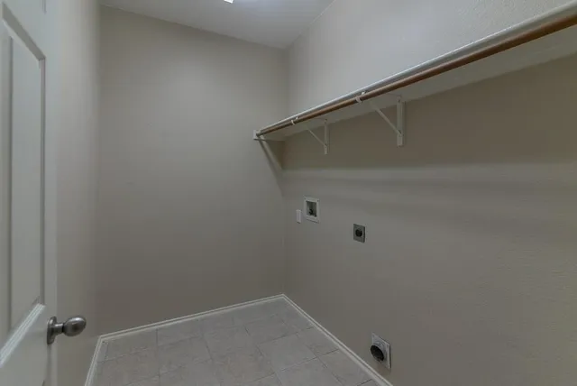 a view of a room with window and cabinet