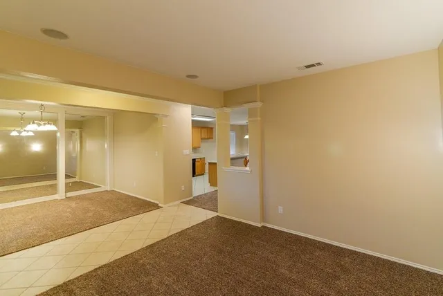 a view of a hallway with wooden shelves