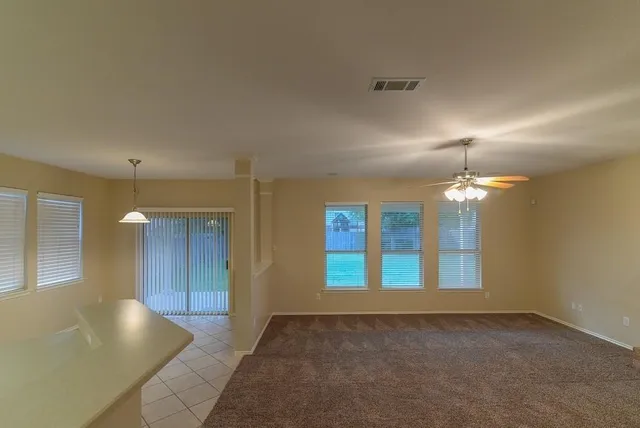 a large bathroom with a large mirror vanity and a shower