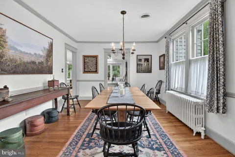 a living room with furniture a rug and a large window