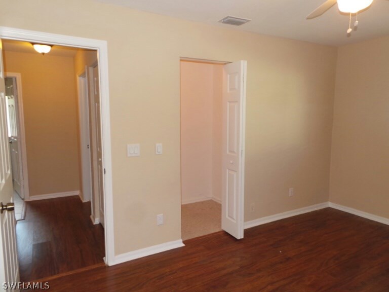 17448 Lee Road Fort Myers, FL 33967 - Photo 14 of 20 an empty room with wooden floor and closet
