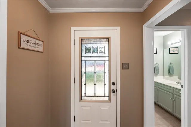 a view of a bathroom from a corridor