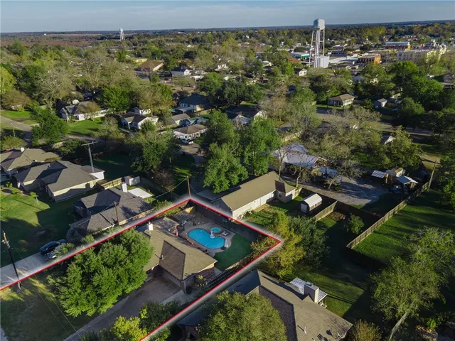 an aerial view of residential house with outdoor space