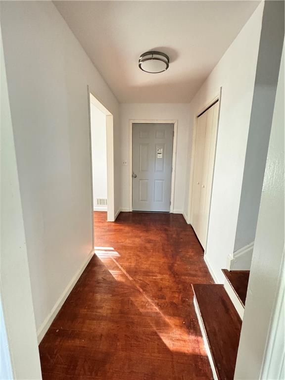 5297 Cardinal Lane Northwest Lilburn, GA 30047 - Photo 16 of 31 a view of empty room with wooden floor