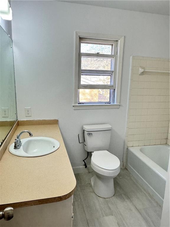 5297 Cardinal Lane Northwest Lilburn, GA 30047 - Photo 20 of 31 a bathroom with a sink and a toilet