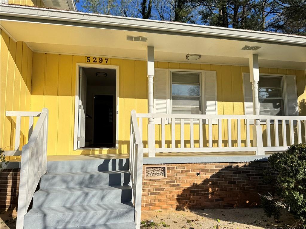 5297 Cardinal Lane Northwest Lilburn, GA 30047 - Photo 2 of 31 a front view of a house with a outdoor space