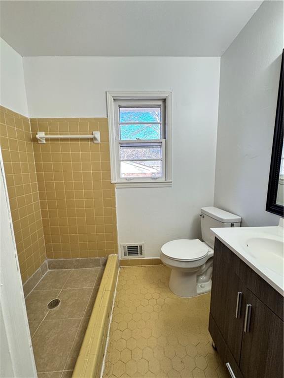 5297 Cardinal Lane Northwest Lilburn, GA 30047 - Photo 22 of 31 a bathroom with a sink a toilet and shower