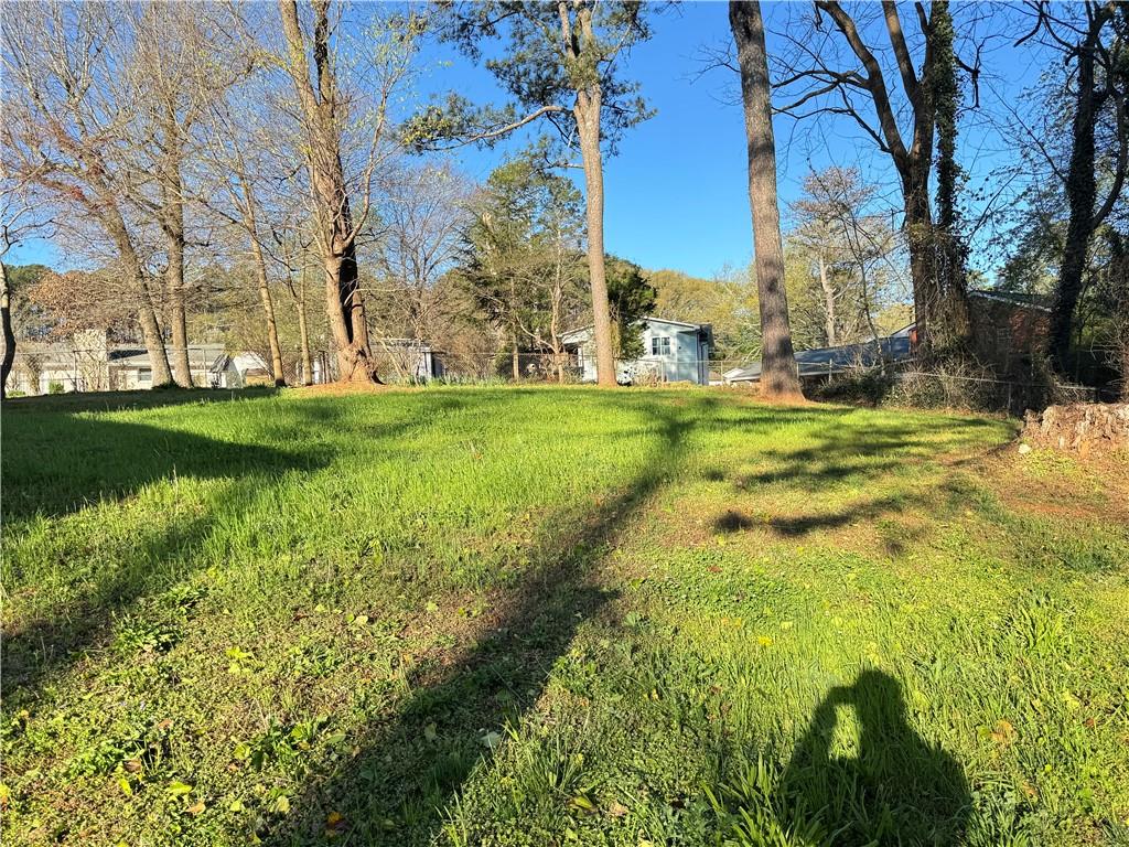 5297 Cardinal Lane Northwest Lilburn, GA 30047 - Photo 7 of 31 a view of a yard with a house