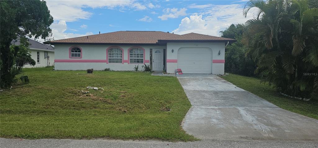 2138 Amstead Street Punta Gorda, FL 33980 - Photo 1 of 1 a front view of a house with a yard