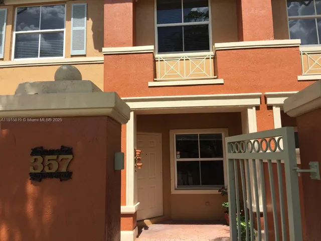 a front view of a house with a garage