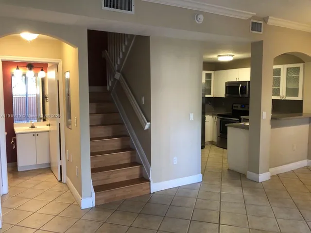 a view of a kitchen from the hallway