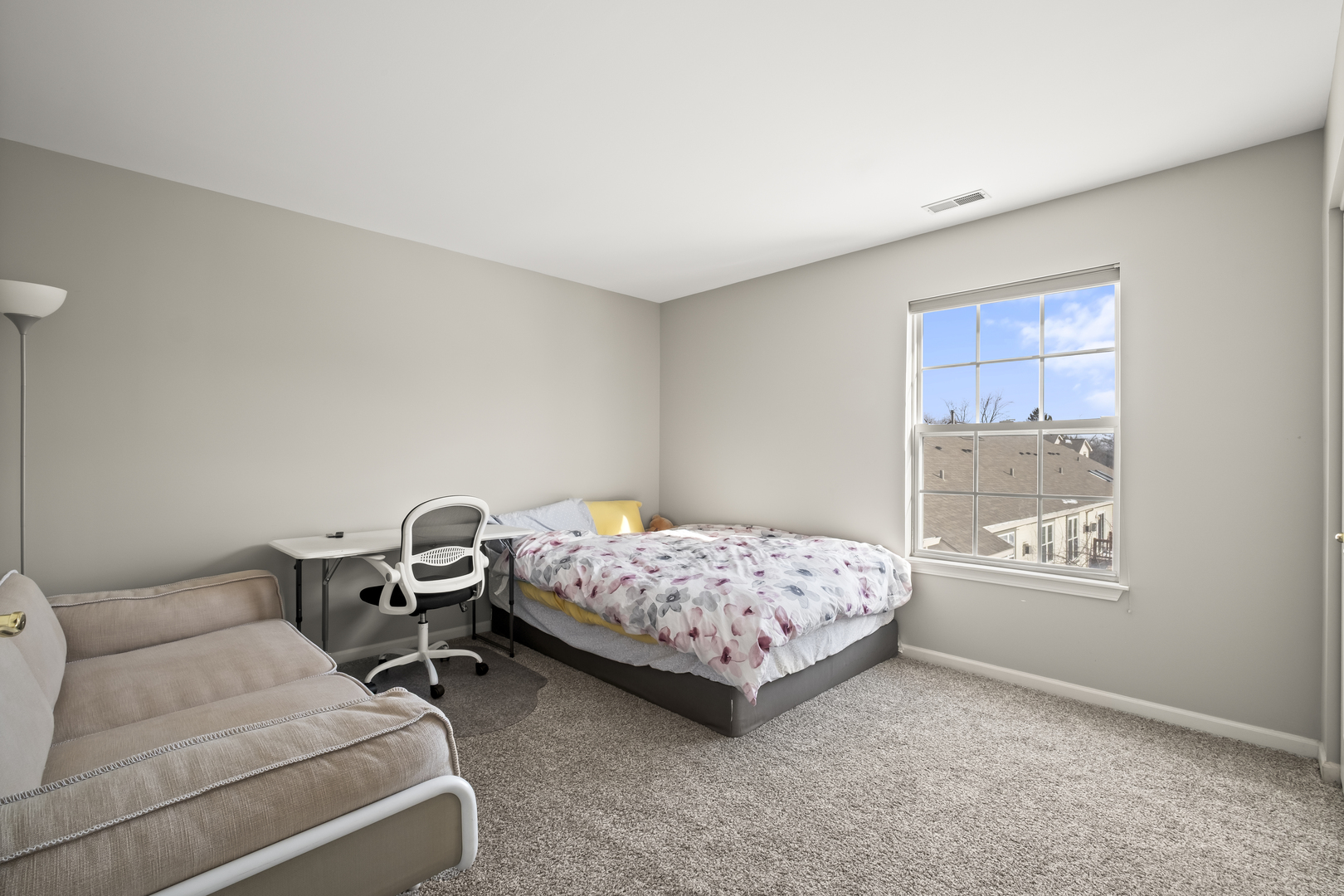 7917 Windsor Drive Darien, IL 60561 - Photo 15 of 31 a bedroom with furniture and a window