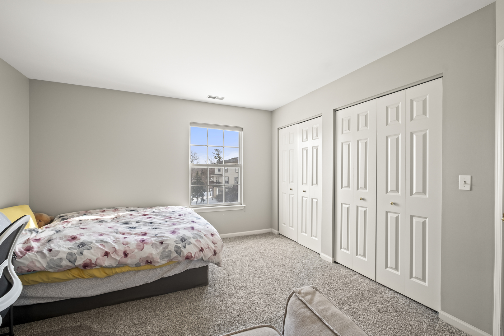 7917 Windsor Drive Darien, IL 60561 - Photo 16 of 31 a bedroom with a bed and a window