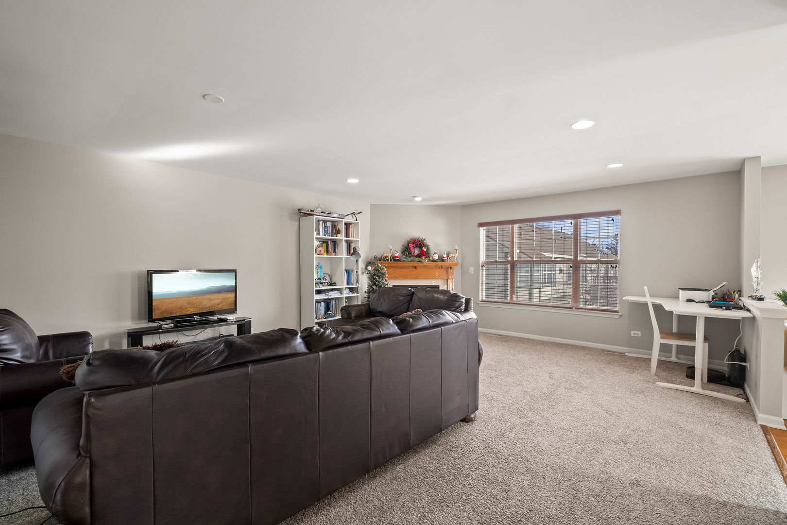 7917 Windsor Drive Darien, IL 60561 - Photo 4 of 31 a living room with furniture and a flat screen tv