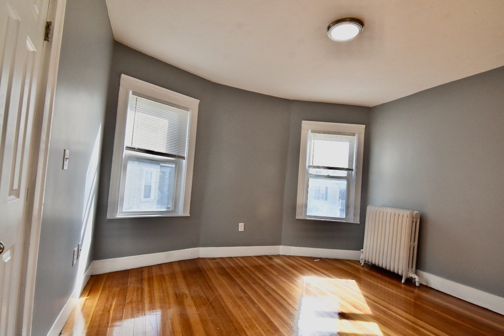 21 Treadway Road, Unit 2 Boston, MA 02125 - Photo 12 of 21 a view of room with window and wooden floor