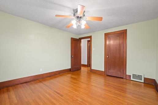 1611 Roemer Boulevard Farrell, PA 16121 - Photo 15 of 35 a view of an empty room with window and wooden floor