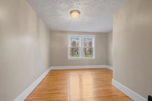 a view of water heater room with refrigerator