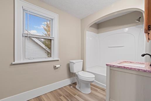 1611 Roemer Boulevard Farrell, PA 16121 - Photo 20 of 35 a white toilet sitting next to a bathroom sink