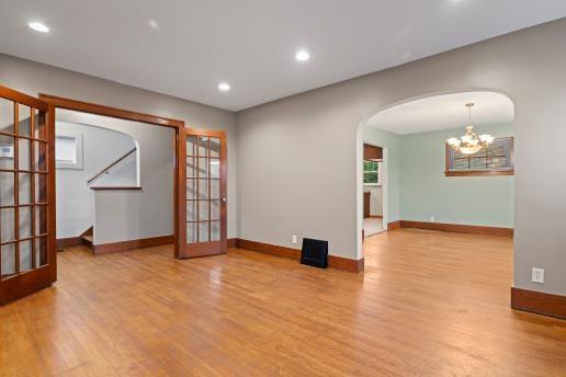 1611 Roemer Boulevard Farrell, PA 16121 - Photo 8 of 35 a view of an empty room with wooden floor and a window
