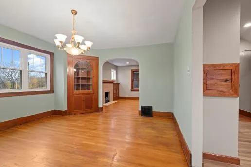 a view of a hallway with a chandelier