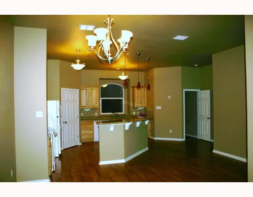 a kitchen with a refrigerator and a microwave