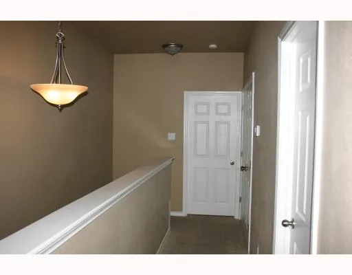 a view of a livingroom with furniture and chandelier