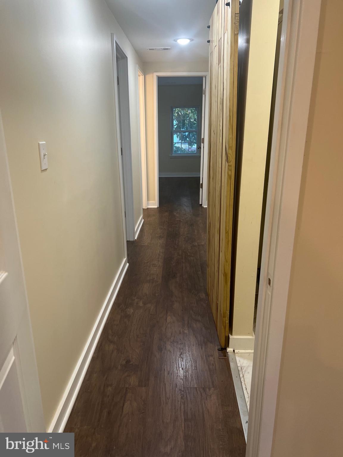 5732 Bugler Street Capitol Heights, MD 20743 - Photo 15 of 23 a view of a hallway with wooden floor
