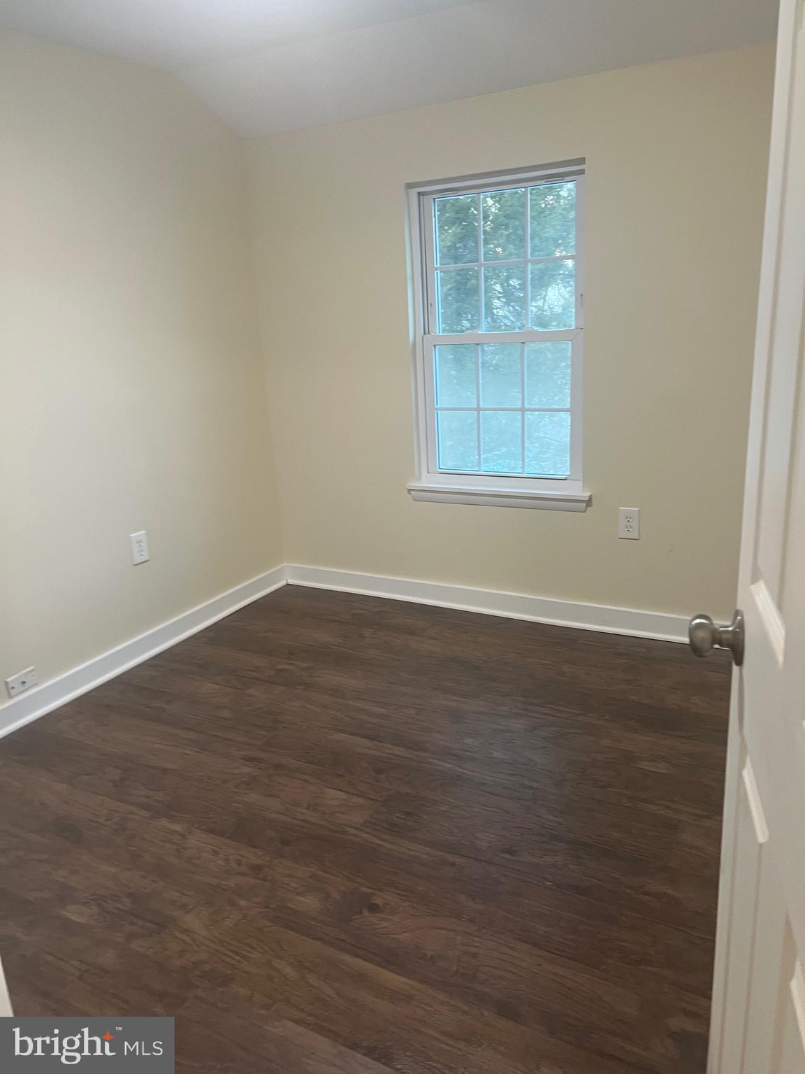 5732 Bugler Street Capitol Heights, MD 20743 - Photo 17 of 23 an empty room with wooden floor and windows