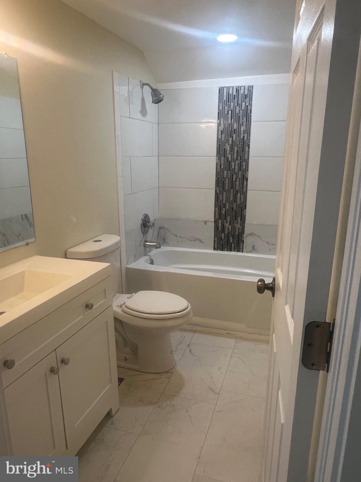 5732 Bugler Street Capitol Heights, MD 20743 - Photo 20 of 23 a bathroom with a sink a toilet and shower