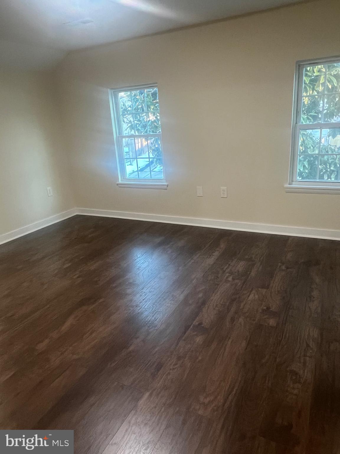 5732 Bugler Street Capitol Heights, MD 20743 - Photo 22 of 23 an empty room with wooden floor and windows