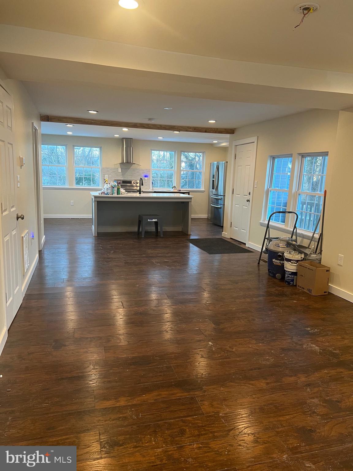 5732 Bugler Street Capitol Heights, MD 20743 - Photo 6 of 23 a view of kitchen and dining room with furniture window and wooden floor