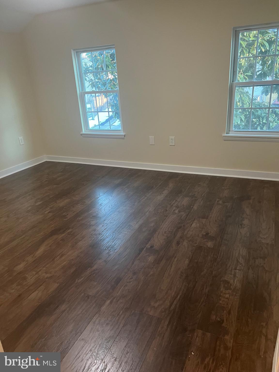 5732 Bugler Street Capitol Heights, MD 20743 - Photo 8 of 23 an empty room with wooden floor and windows
