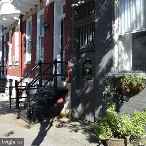 a view of path along with lots of flower plants