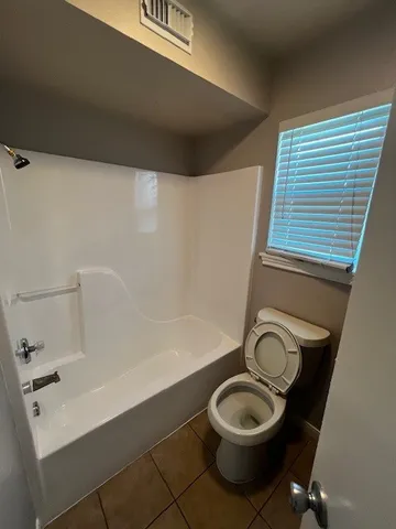 a bathroom with a toilet and a sink