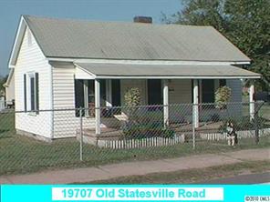a view of a house with glass door and porch
