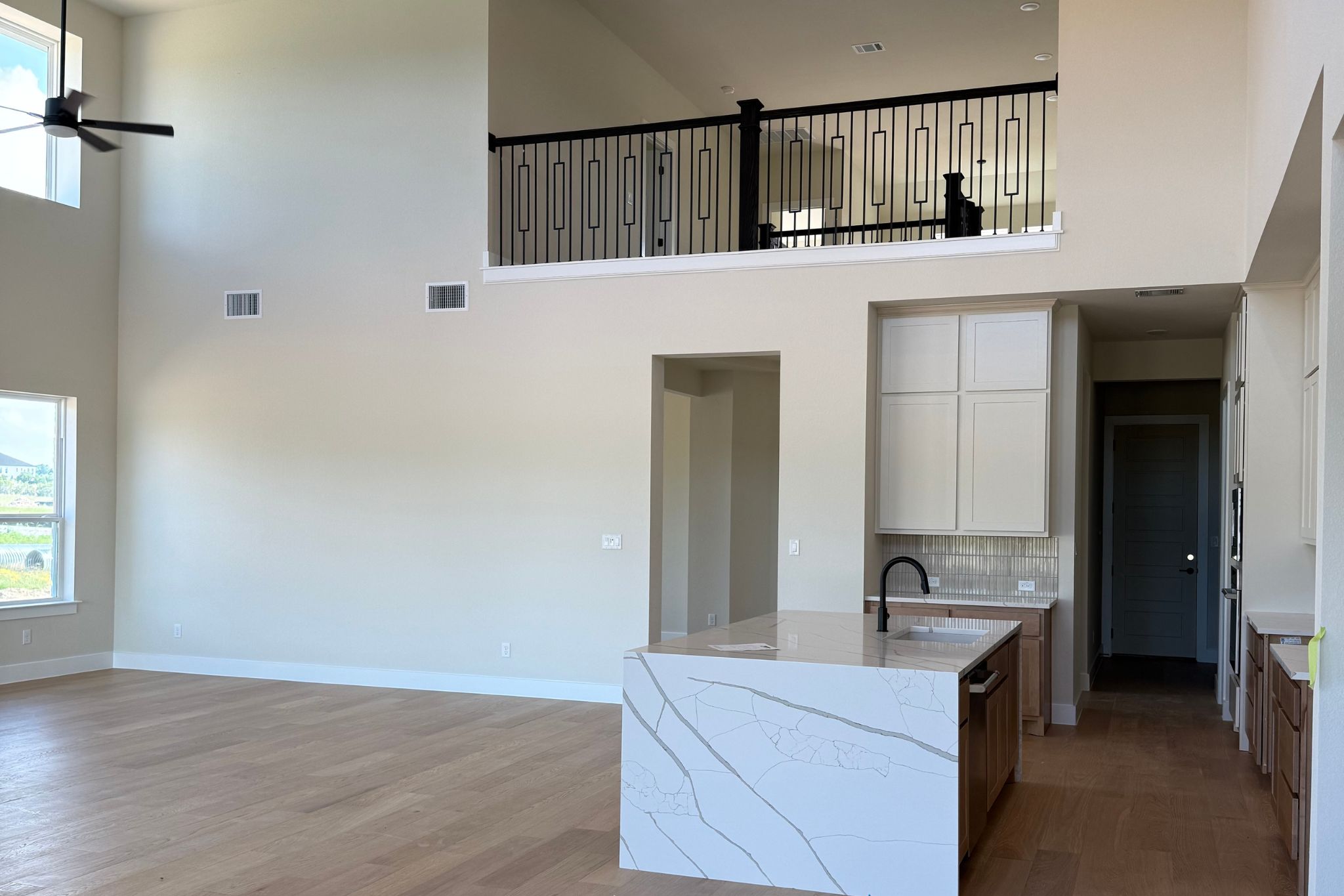 1412 Paxton Lane Georgetown, TX 78633 - Photo 6 of 14 a kitchen with a sink and a refrigerator